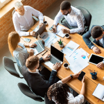 Office workers at a desk collaborating